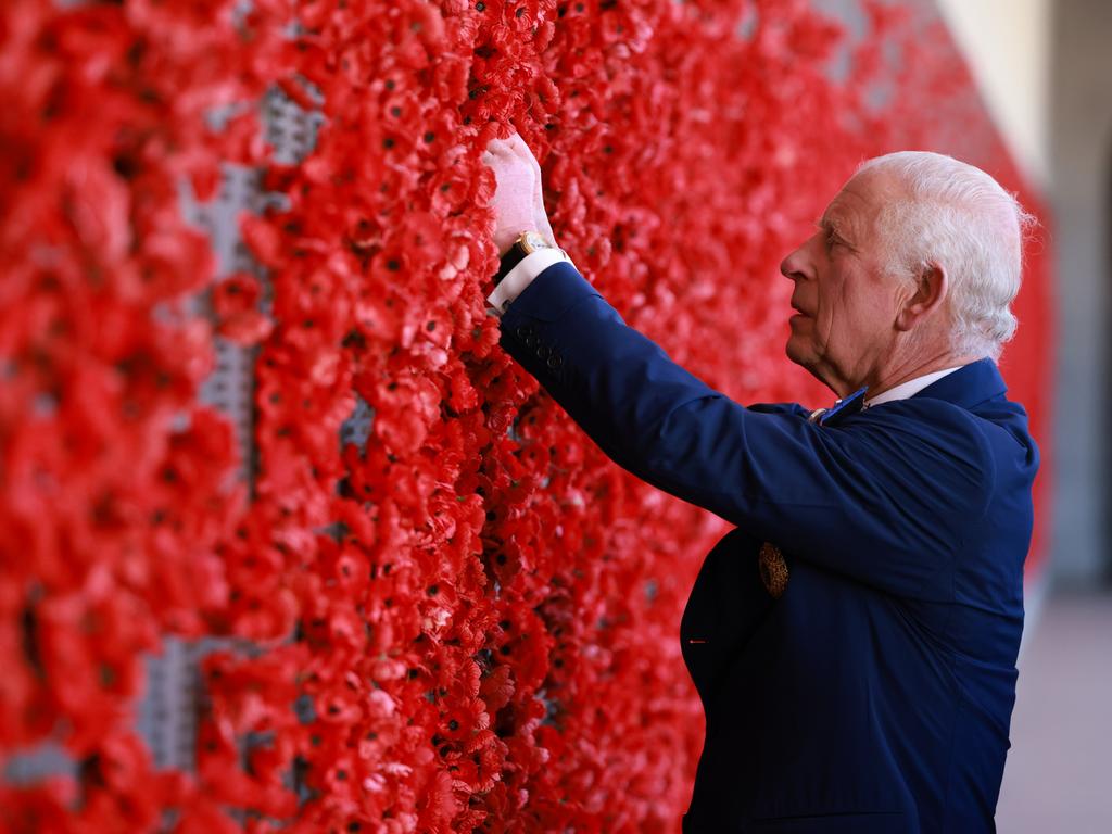 King Charles lays a poppy at the Australian War Memorial on Monday. Picture: Getty Images