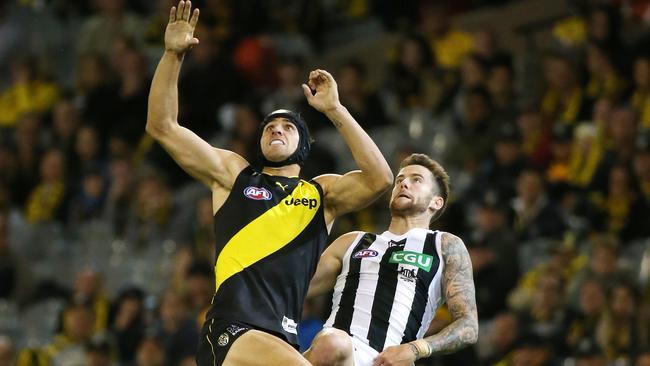 Ben Griffiths flies for a mark against Collingwood in Round 2 of last season. Picture: George Salpigtidis