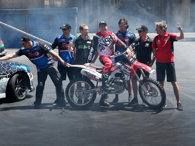 V8 Supercar drivers join Movie World Hollywood Stunt Driver 2 Show at Movie World on the Gold Coast. Left to right the drivers are,Paul Morris Steve Owen, David Reynolds, Rick Kelly, Chaz Mostert ,Tim Slade, and Warren Luff. Picture Glenn Hampson