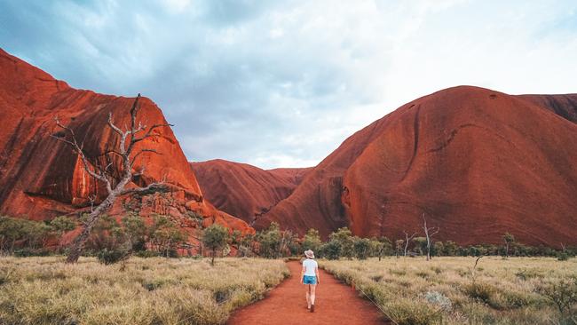 Uluru is one of the great natural wonders of the world. It doesn’t need to be climbed to be enjoyed. Picture: Tourism NT/Jackson Groves