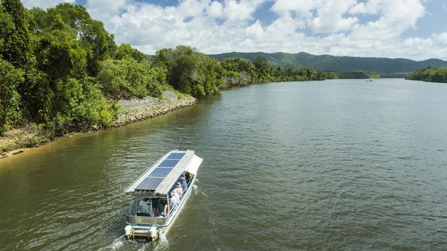 Aerial view of the Solar Whisper Wildlife and Crocodile Cruise boat, heading up the Daintree River. Photo: TTNQ