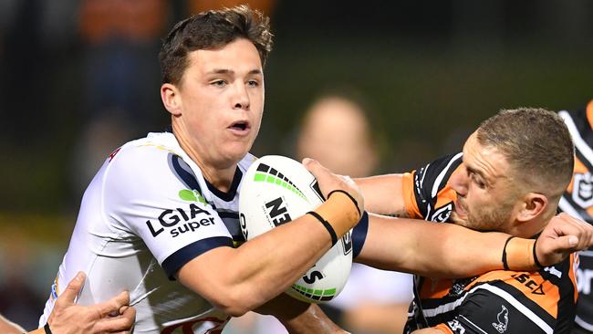 Robbie Farah of the Tigers tackles Scott Drinkwater of the Cowboys during the Round 20 NRL match between the Wests Tigers and the North Queensland Cowboys at Leichhardt Oval in Sydney, Thursday, August 1, 2019. (AAP Image/Dean Lewins) NO ARCHIVING, EDITORIAL USE ONLY