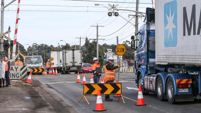 Workers at the Camp Road level crossing. Picture: Tim Carrafa