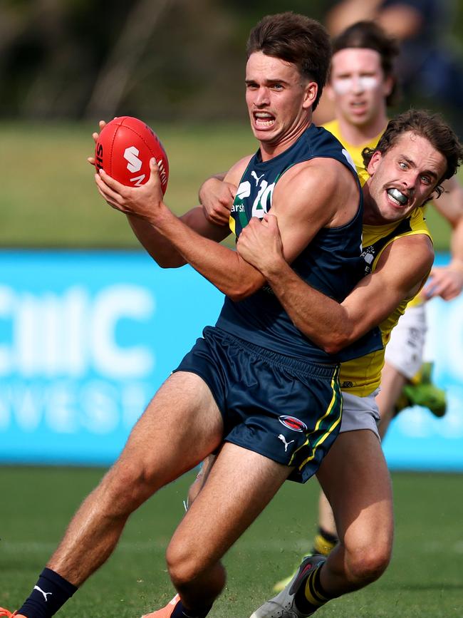 Tom McCarthy lays a tackle during a game against the AFL Academy in April.