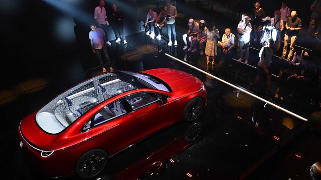 Visitors watch the premiere presentation of the Mercedes Benz Concept CLA Class during the International Motor Show IAA in Munich. Photo: Christof STACHE / AFP