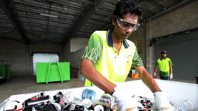 Alfred Gray sorts a delivery of recyclable containers at the new Cash for Containers recycling centre in Edmonton, Far Norht Queensland. PICTURE: STEWART MCLEAN