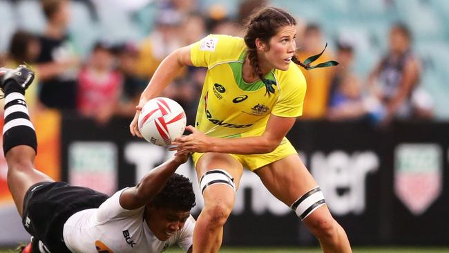 World Rugby Sevens - Charlotte Caslick shone for Australia on day one,  scoring four tries and helping her side to a quarter final spot.