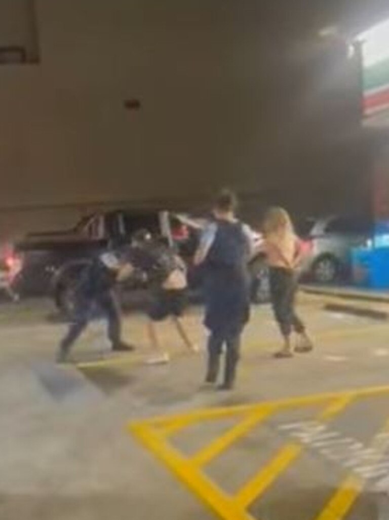 The man then begins repeatedly punching the other police officer. Picture: Only in Guildford/Facebook
