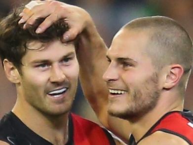 MELBOURNE, AUSTRALIA - MAY 31: Ben Howlett of the Bombers is congratulated after kicking a goal during the round 11 AFL match between the Essendon Bombers and the Richmond Tigers at Melbourne Cricket Ground on May 31, 2014 in Melbourne, Australia. (Photo by Scott Barbour/Getty Images)