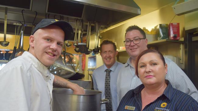 HEATING UP: Apprentice chef Josh Cooper shows Minister for Vocational Education and Skills Luke Hartsuyker how it's done, while Federal MP George Christensen and Airlie Beach Hotel HR manager Jenny Trewartha watch on. Photo: Deborah Friend / Whitsunday Times. (04/06/2015)