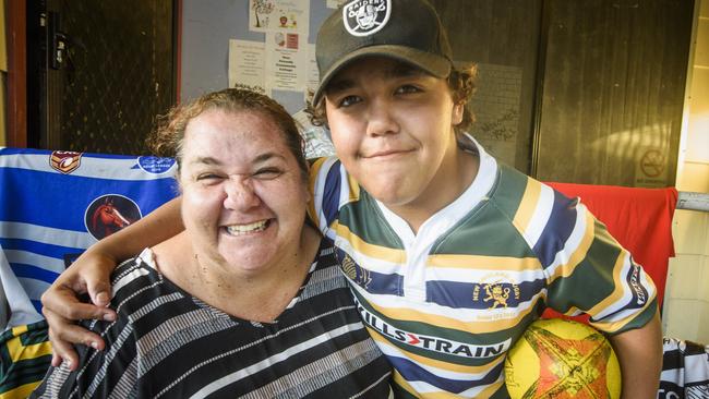 Camellia Cottage youth worker Mel Livermore gets in the scrum with Ashdon Randall. The cottage donated $100 towards Ashdon's upcoming rugby tour to New Zealand.