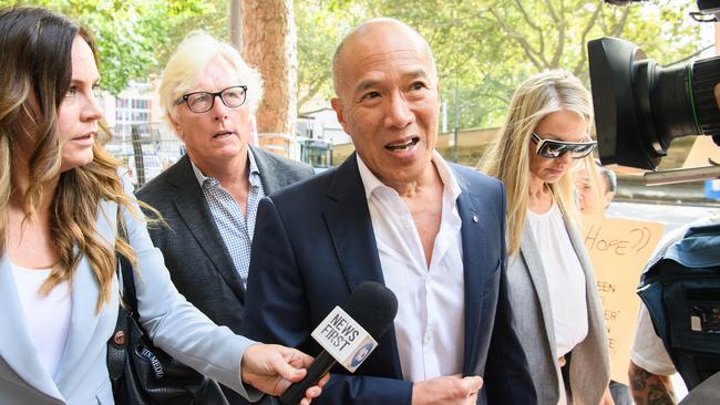 Neurosurgeon Charlie Teo (centre) arrives to a Health Care Complaints Commission Professional Standards Committee inquiry in Sydney, Monday, February 13, 2023. (AAP Image/Bianca De Marchi)