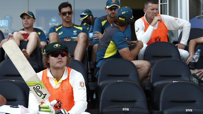 Young Australian batsman Will Pucovski (bottom left) looks on from the sidelines during the first Test against Sri Lanka at the Gabba. Picture: Getty Images