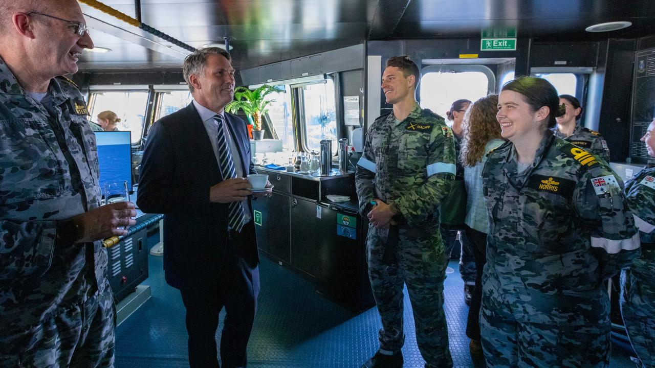 Commanding Officer HMAS Adelaide, Captain Stuart Watters RAN with Defence Minister Richard Marles and Petty Officer Jacob Machen and Marine Engineer Officer Lieutenant Commander Kirstin Norris at Fleet Base East in Sydney. Picture: ABIS Benjamin Ricketts