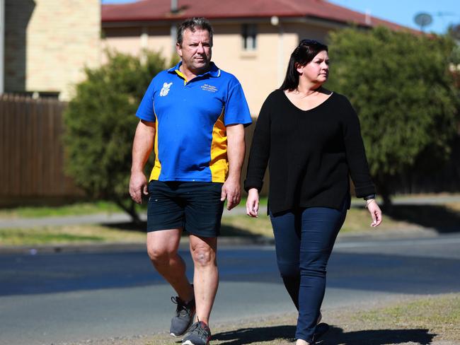 Rouse Hill residents Kelly Zammit and Neil Poullos pose for photographs looking towards the proposed bus depot on Mile End Rd in Rouse Hill Rouse Hill, Saturday, September 1st 2018. Kelly Zammit has hit out at CDC Hills Bus over plans for a massive bus depot across the road from her home. (AAP Image / Angelo Velardo)