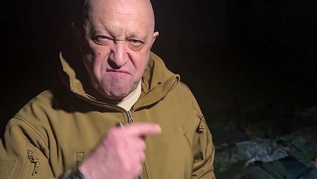 Yevgeny Prigozhin addresses the Russian army's top brass standing in front of bodies he presented as fallen Wagner fighters at an undisclosed location. Picture: AFP.