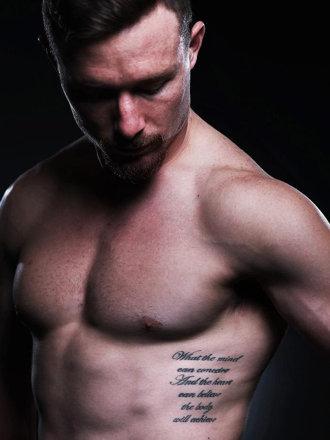 Damien Cook reveals the Ali quote on his ribs. (Phil Hillyard)