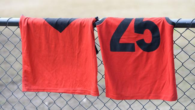 Cooper’s football jumper hangs on the boundary fence at Yarra Glen Football Netball Club. Picture: Lawrence Pinder.