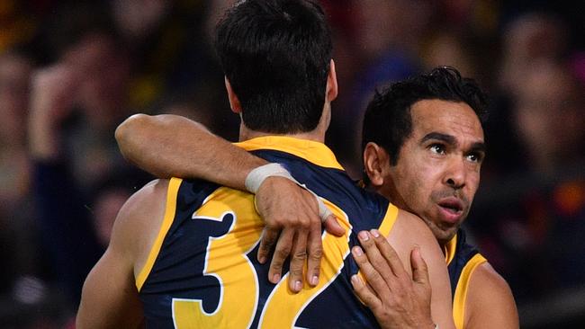 Eddie Betts gets a hug from young teammate Darcy Fogarty after he booted his 600th career goal. Pic: AAP