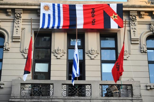 Flags fly at half staff at the Frente Amplio party headquarters in Montevideo following the death of Uruguayan former president Jose 'Pepe' Mujica