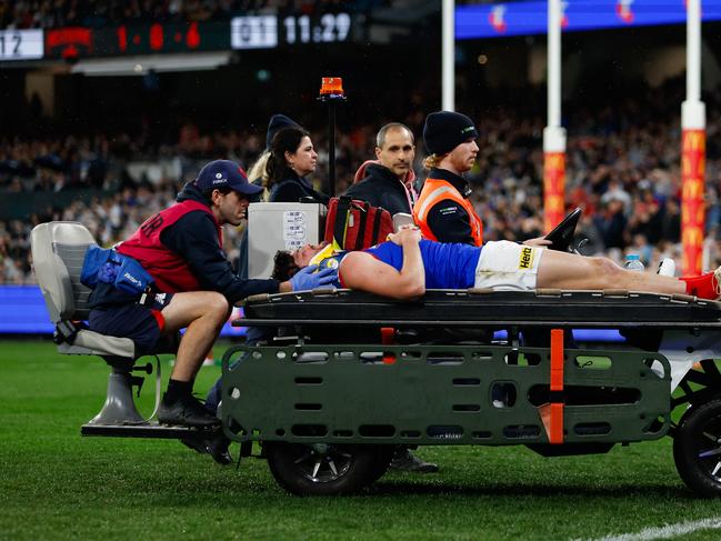 Angus Brayshaw leaves the field on a stretcher during the Qualifying Final match between Collingwood and Melbourne. Picture: Dylan Burns/AFL Photos via Getty Images.