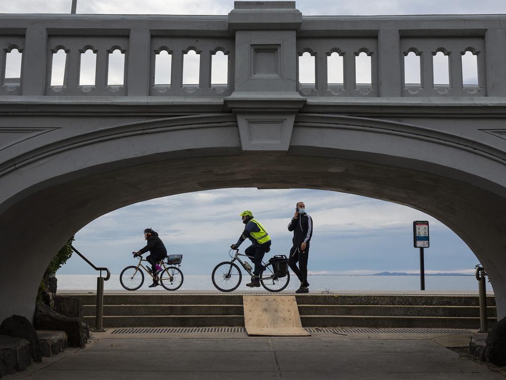 People enjoying their 1 hour of exercise in St Kilda, Victoria. Photo: Daniel Pockett