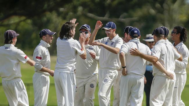 Elsternwick players get around Jacob Kerr after his wicket against Moorabbin. Picture: Valeriu Campan