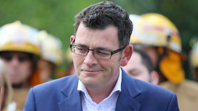 Premier Daniel Andrews holds a press conference at Parliament with firefighters. Picture: Alex Coppel.