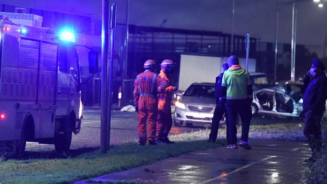 Emergency crews and police at the scene in Truganina. Picture: Josie Hayden