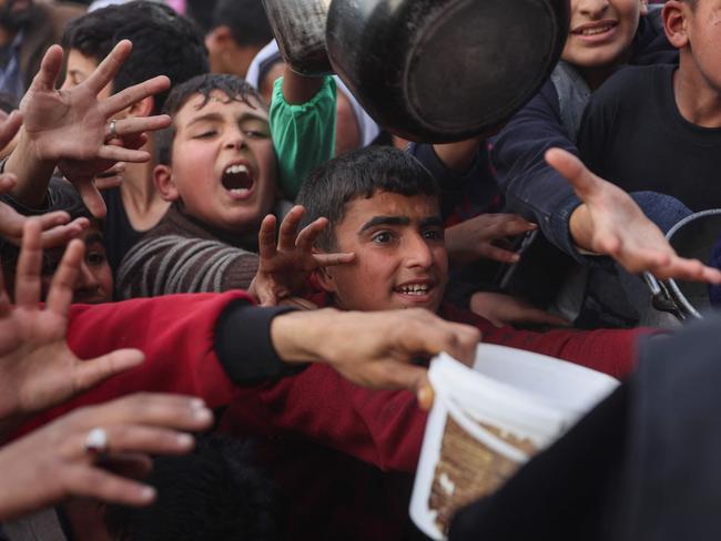 Palestinians are relying on generators and burning fires since Israel cut off power to the Strip. Picture: AFP