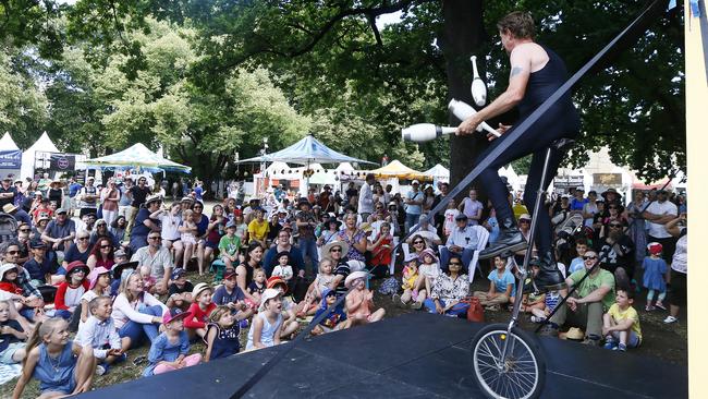 The Great Dave entertains a large group of children on Parliament lawns. Picture: MATT THOMPSON