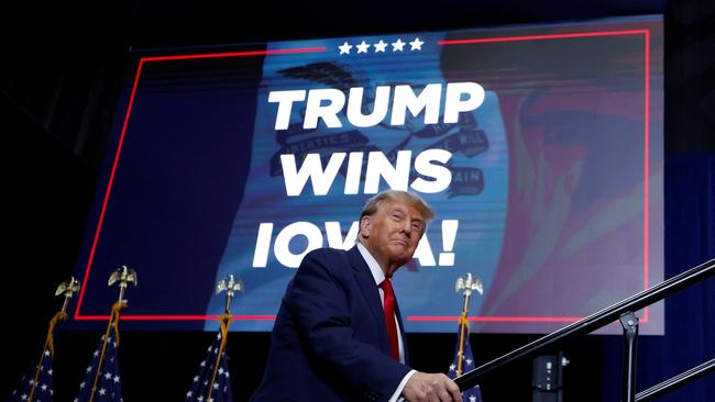 Former president Donald Trump takes the stage during his Iowa caucus night watch party in Des Moines.