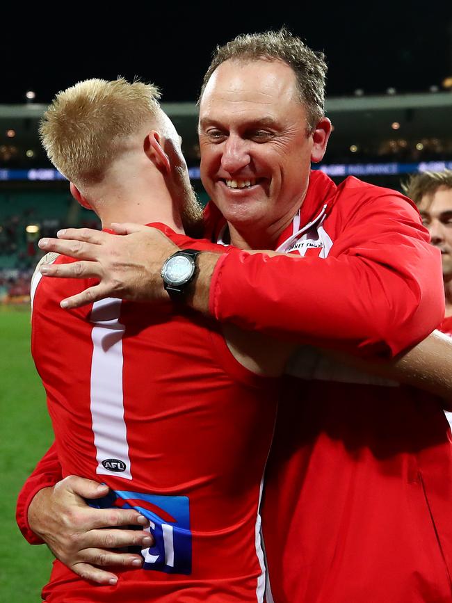 James Rose and John Longmire embrace after a win over West Coast at the SCG in round 12 this season. Picture: Cameron Spencer/AFL Photos/Getty Images