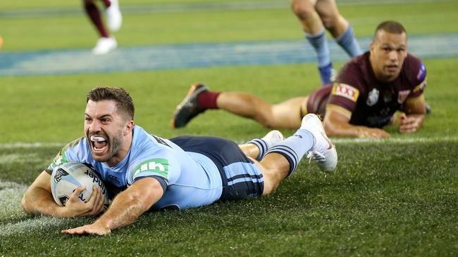 NSW fullback James Tedesco slides over for the opening try of the night against Queensland at the MCG. Picture: Michael Klein