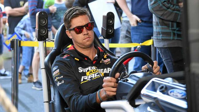 Chaz Mostert tries out the driving simulator at the Supercars fan day at Springfield. Picture: Rob Williams