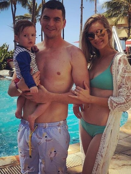 Port Adelaide midfielder Tom Rockliff with fiancee Sharna and son Jack.