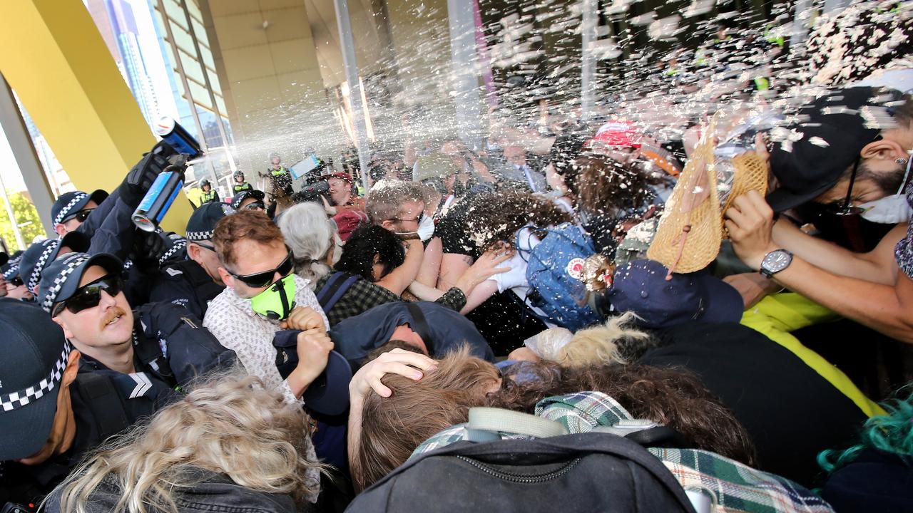 Police try to disburse Anti-Mining protesters trying to disrupt a mining conference, using capsicum spray, at the Melbourne Convention and Exhibition Centre. Stuart McEvoy/The Australian.