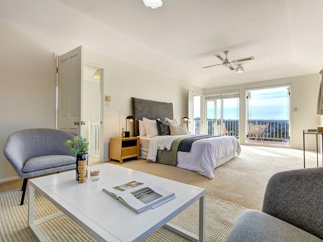 The main bedroom has a balcony with views.