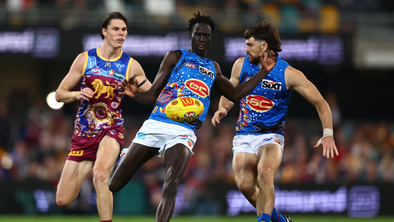 Gold Coast Suns defender Mac Andrew (centre) was the victim of racial abuse in Saturday’s QClash. Picture: Chris Hyde / Getty Images