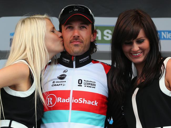 OUDENAARDE, BELGIUM - MARCH 31:  Race winner Fabian Cancellara of Switzerland and RadioShack Leopard standards on top of the podium as Peter Sagan of Slovakia and Cannondale looks on during the 97th Tour of Flanders from Brugge to Oudenaarde on March 31, 2013 in Oudenaarde, Belgium.  (Photo by Bryn Lennon/Getty Images)