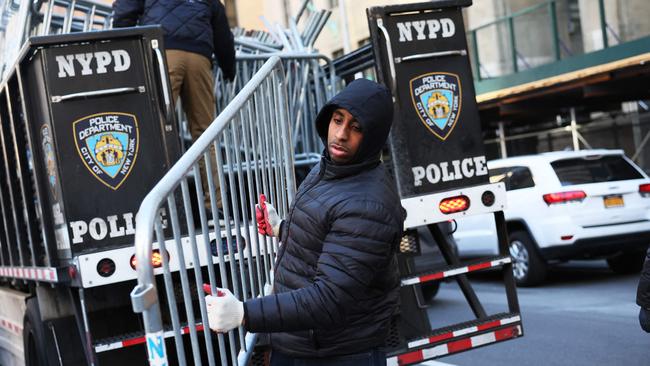 NYPD drop off metal barricades in front of Manhattan Criminal Court in New York City. Picture: Getty Images.