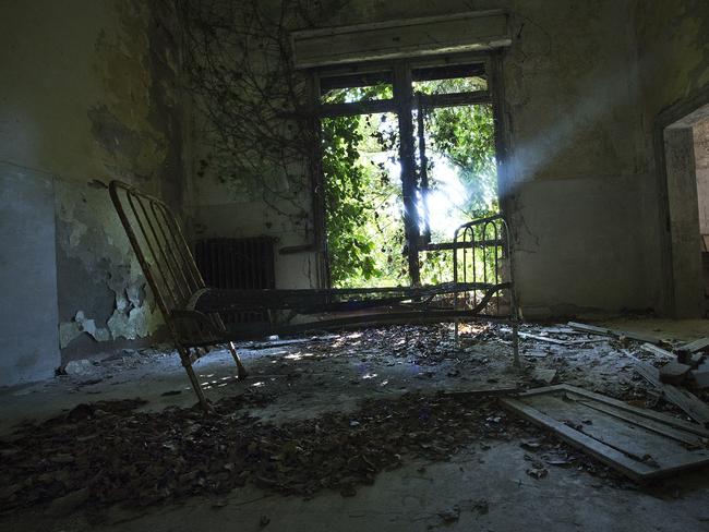A bed remains .. in a room in the mental asylum ... on Poveglia Island. Picture: Ella Pellegrini
