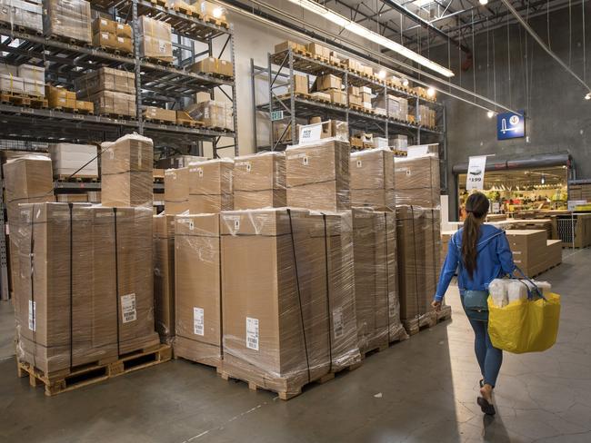 A shopper carries a bag inside an IKEA AB store in Emeryville, California, U.S., on Tuesday, Aug. 9, 2016. The U.S. Census Bureau is scheduled to release business inventories figures on Aug. 12. Photographer: David Paul Morris/Bloomberg