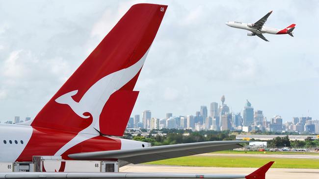 ESCAPE: Cover Story, Dec 17 -  "Sydney, Australia - March, 14th 2012: Quantas aeroplanes and tail fin with the distant view of downtown Sydney - Sydney Airport"  Picture: Istock