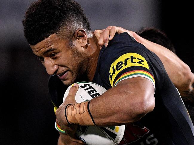 Viliame Kikau of the Panthers is tackled by Shaun Johnson and Peta Hiku (right) of the Warriors during the Round 17 NRL match between the Penrith Panthers and the Warriors at Panthers Stadium in Sydney, Friday, July 6, 2018. (AAP Image/Dan Himbrechts) NO ARCHIVING, EDITORIAL USE ONLY