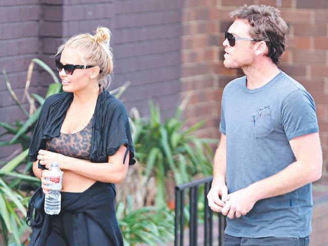 Sam Worthington grabs coffee and water before heading to the gym with Lara Bingle / Picture: INF