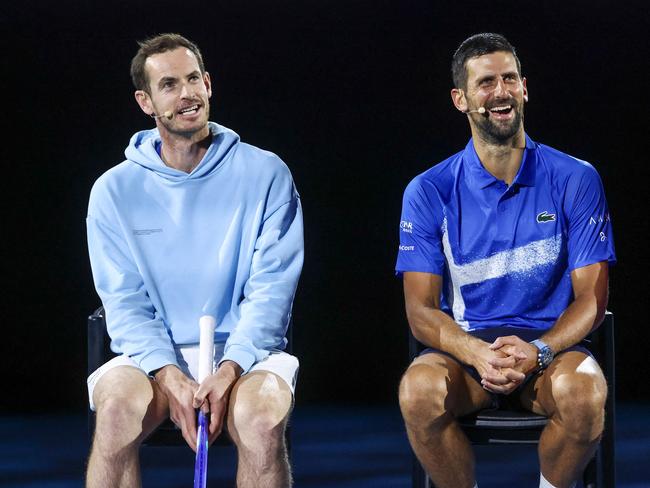 TOPSHOT - Britainâs Andy Murray (L) reacts with Serbiaâs Novak Djokovic during a charity event titled âNight with Novakâ on Rod Laver Arena in Melbourne on January 9, 2025 ahead of the Australian Open tennis championship starting on January 12. (Photo by DAVID GRAY / AFP) / -- IMAGE RESTRICTED TO EDITORIAL USE - STRICTLY NO COMMERCIAL USE --