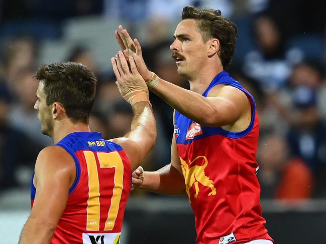 GEELONG, AUSTRALIA - MARCH 26: Joe Daniher of the Lions is congratulated by Jarryd Lyons after kicking a goalduring the round 2 AFL match between the Geelong Cats and the Brisbane Lions at GMHBA Stadium on March 26, 2021 in Geelong, Australia. (Photo by Quinn Rooney/Getty Images)