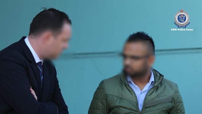 One of the men (right) was arrested after raids at the Guildford West business and a Merrylands home on July 11, 2019.