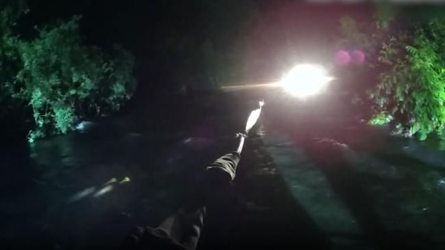 Water was rushing fast and almost touching the tops of trees as emergency crews helped to rescue motorists trapped in two cars on Gillies Range Road in Goldsborough. Picture: Supplied.